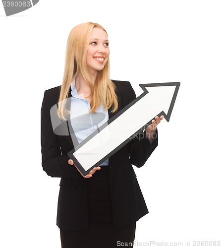 Image of smiling businesswoman with direction arrow sign