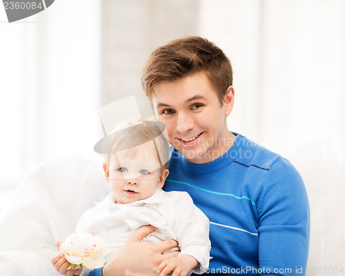 Image of happy father with adorable baby