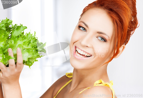 Image of woman holding lettuce