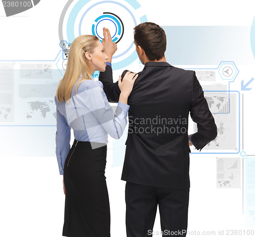 Image of man and woman working with virtual screen