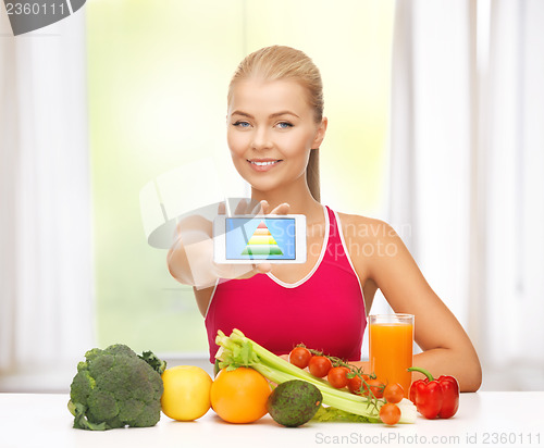 Image of woman with fruits, vegetables and smartphone