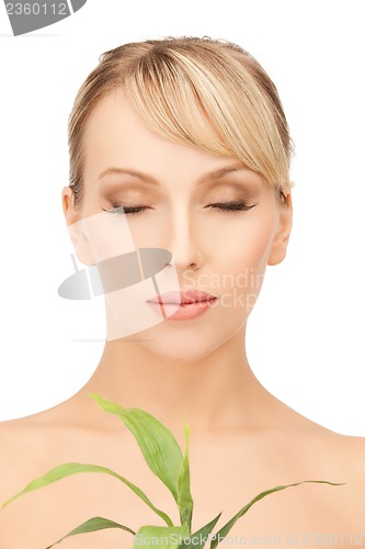 Image of woman with green sprout