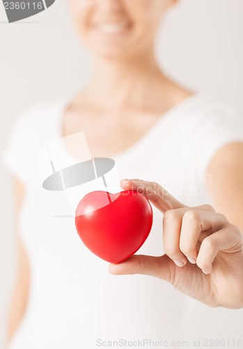 Image of woman hands with heart