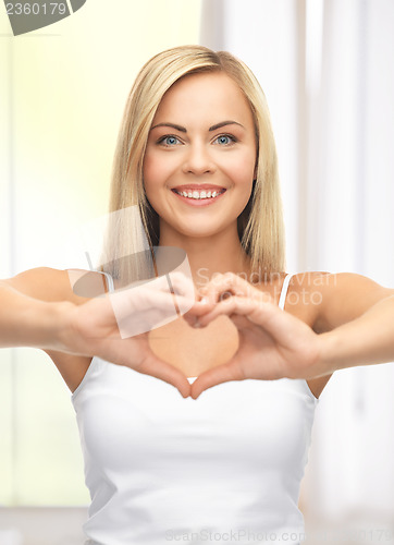 Image of woman showing heart shape