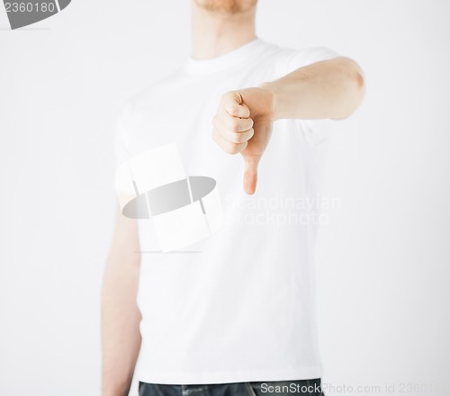 Image of man showing thumbs down