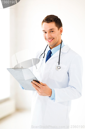 Image of male doctor writing prescription