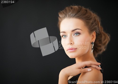 Image of woman with diamond earrings