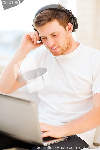 Image of man with headphones listening to music