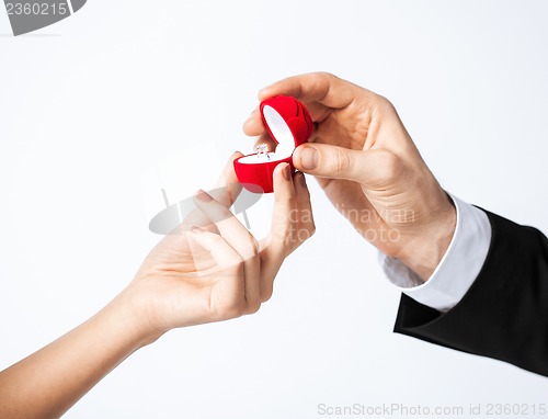 Image of couple with wedding ring and gift box