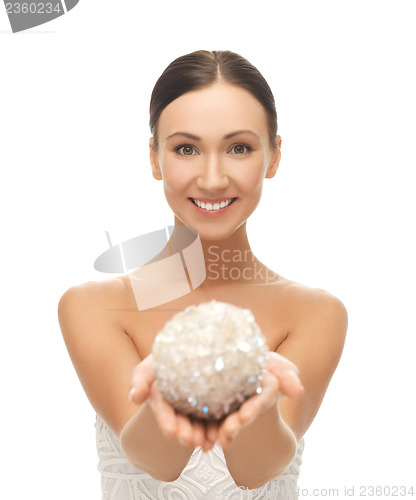 Image of woman with sparkling ball