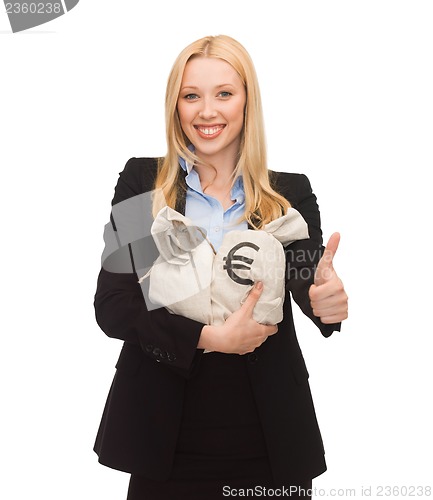 Image of businesswoman with money bags showing thumbs up