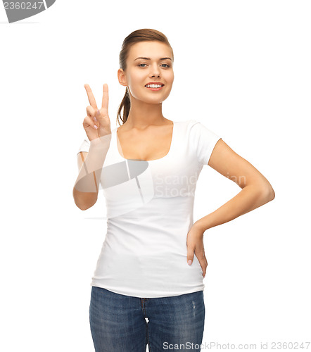 Image of woman showing victory or peace sign