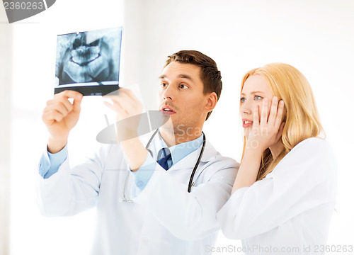 Image of two doctors looking at x-ray