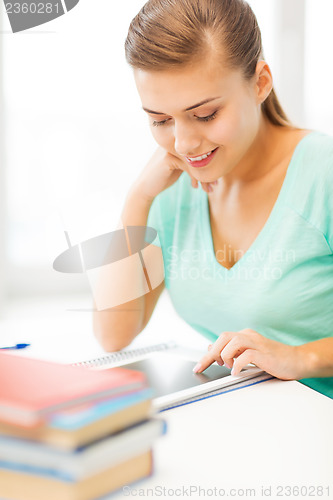 Image of attractive student girl using tablet pc