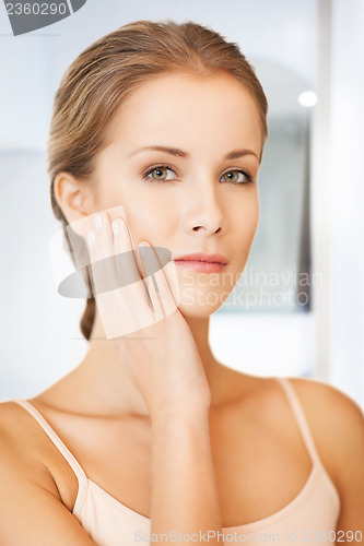 Image of face and hands of beautiful woman