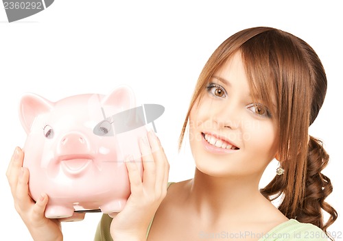 Image of lovely girl with big piggy bank