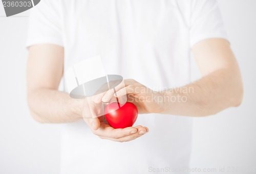 Image of man hands with heart