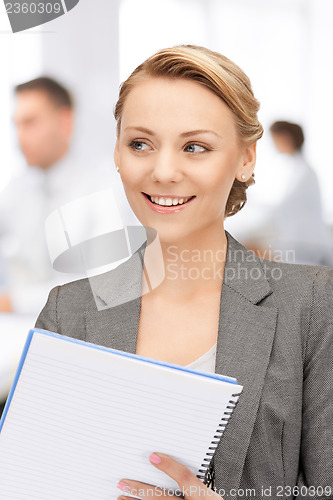 Image of happy woman with big notepad