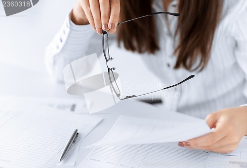 Image of woman hands with blank paper