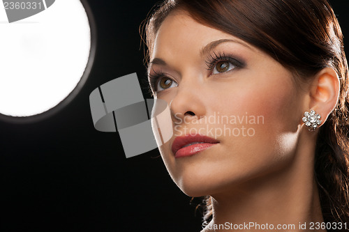 Image of woman with diamond earrings