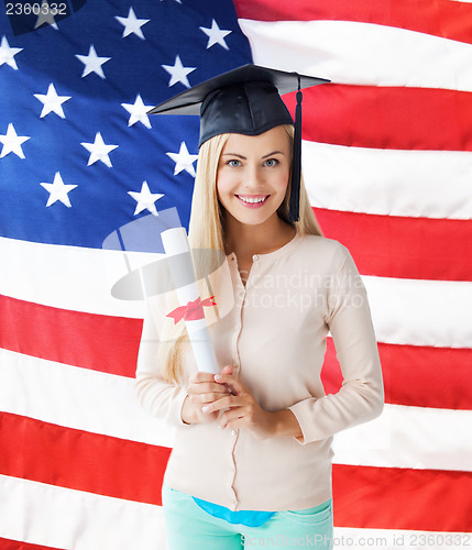 Image of student in graduation cap with certificate