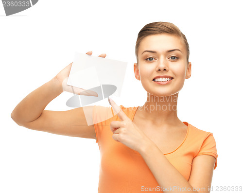 Image of smiling woman pointing at white blank card