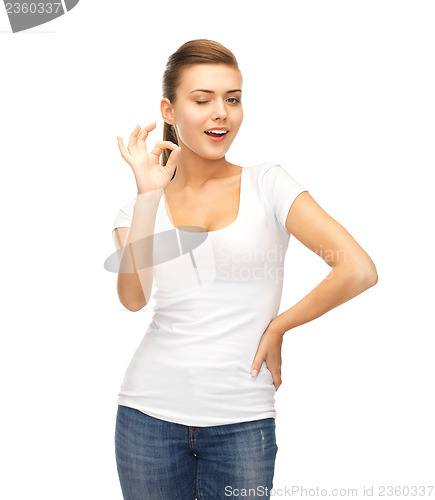 Image of woman in blank white t-shirt showing ok gesture