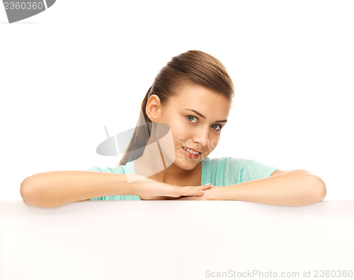 Image of woman with white blank board