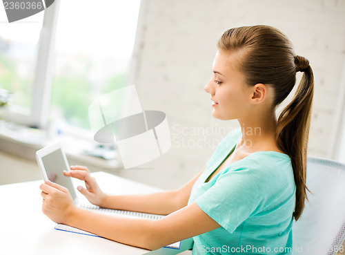 Image of attractive student girl using tablet pc