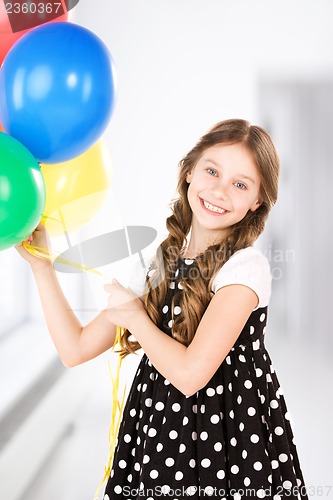Image of happy girl with colorful balloons