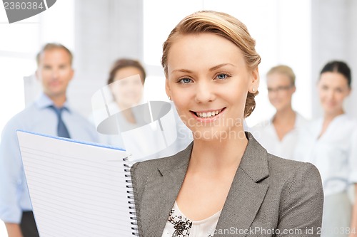 Image of happy woman with big notepad