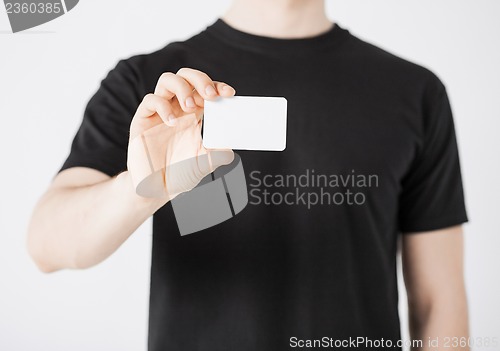 Image of man hand with blank paper