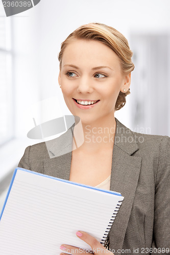 Image of happy woman with big notepad