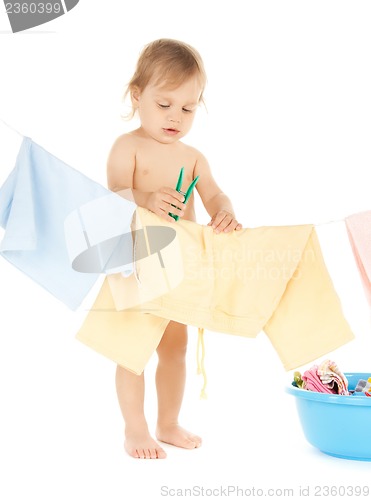 Image of baby doing laundry