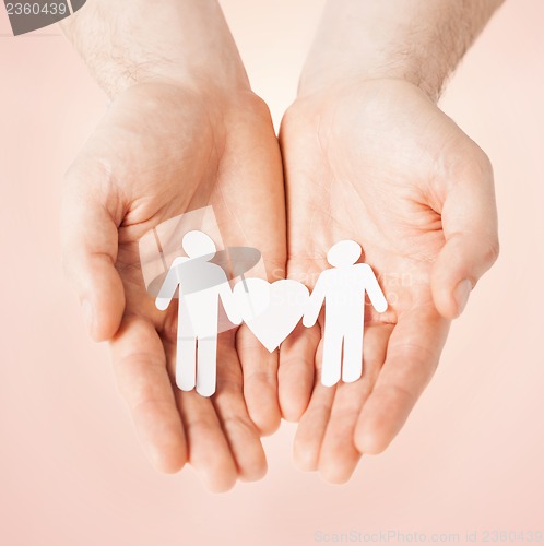 Image of man hands with paper men