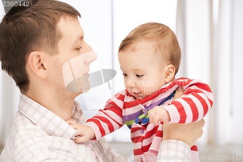 Image of happy father with adorable baby