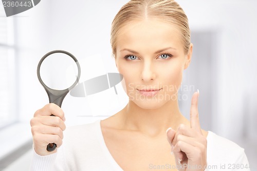 Image of woman with magnifying glass