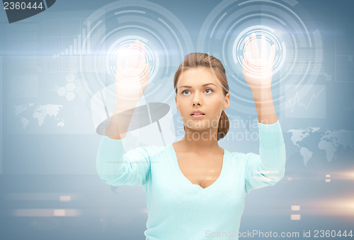 Image of businesswoman working with something imaginary