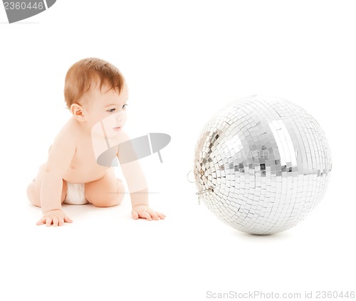 Image of child playing with disco ball