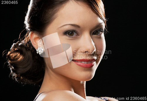 Image of woman with diamond earrings