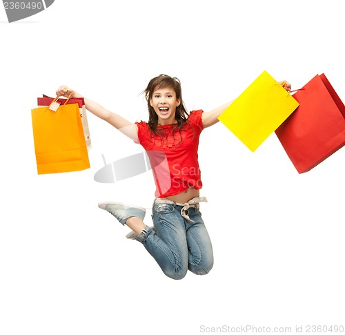 Image of excited girl with shopping bags