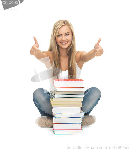 Image of student with stack of books