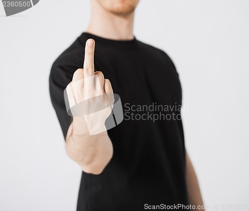 Image of man showing middle finger