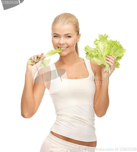 Image of woman biting lettuce