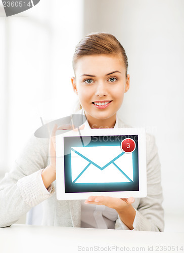 Image of businesswoman with tablet pc in office