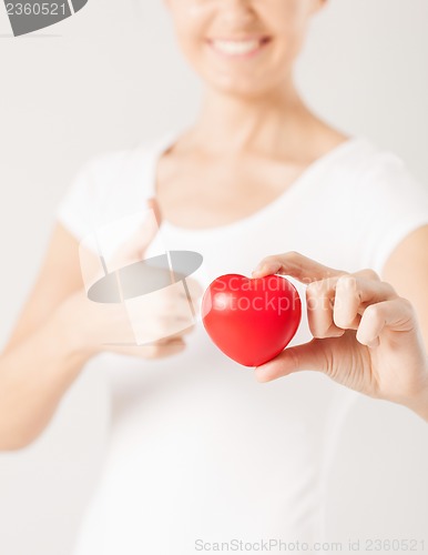 Image of woman hands with heart