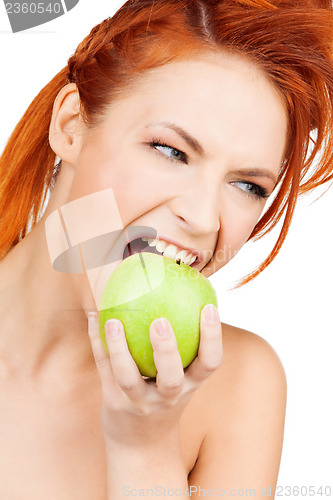 Image of woman biting green apple