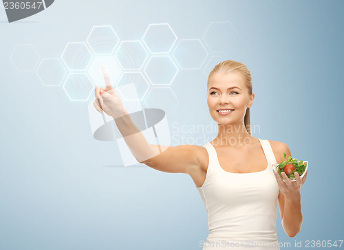 Image of woman with salad and virtual screen