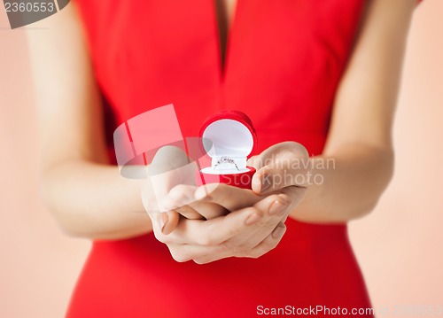 Image of woman showing wedding ring