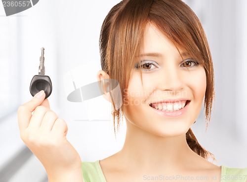 Image of happy girl with car key